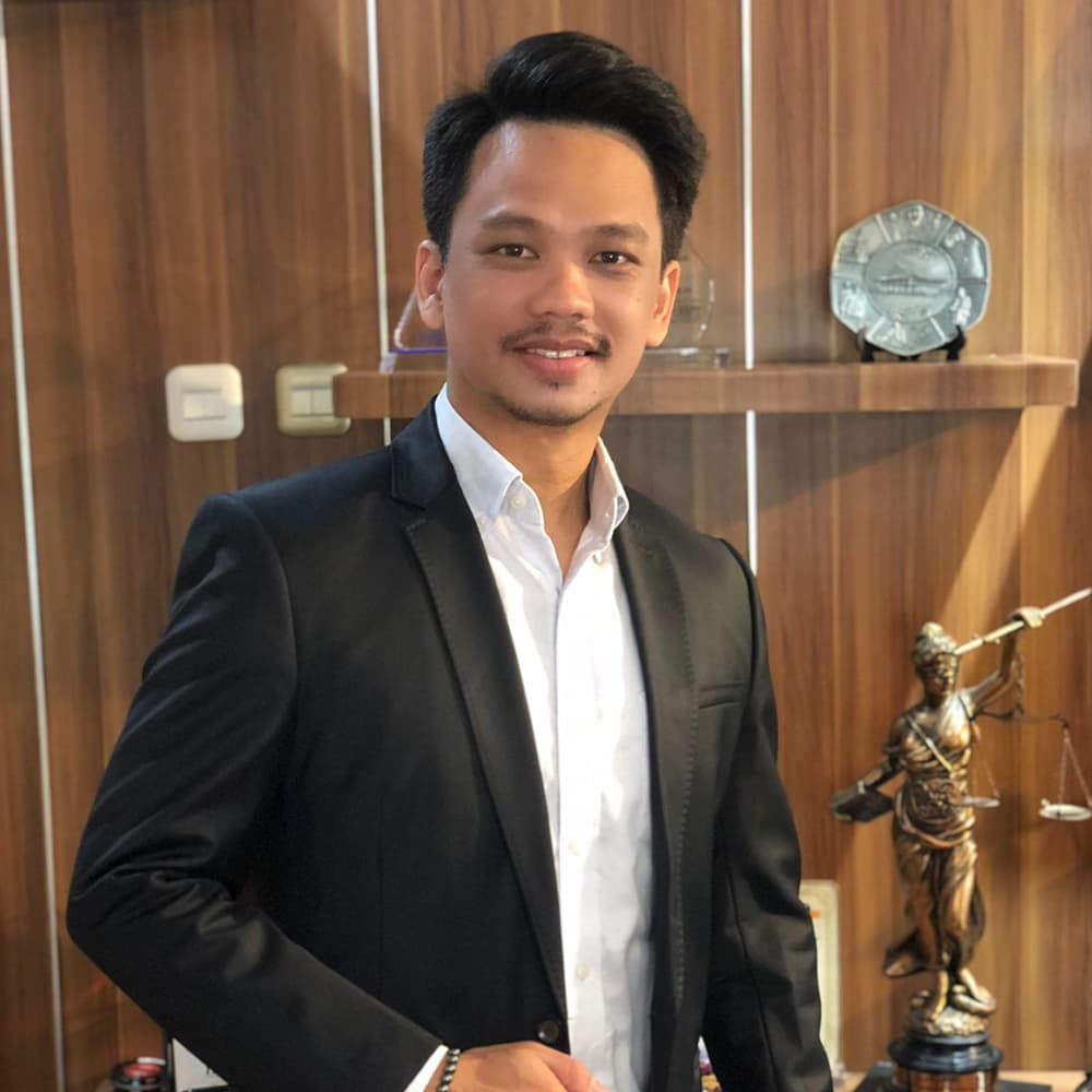 Mick Olaf Monintja SH., MH.
